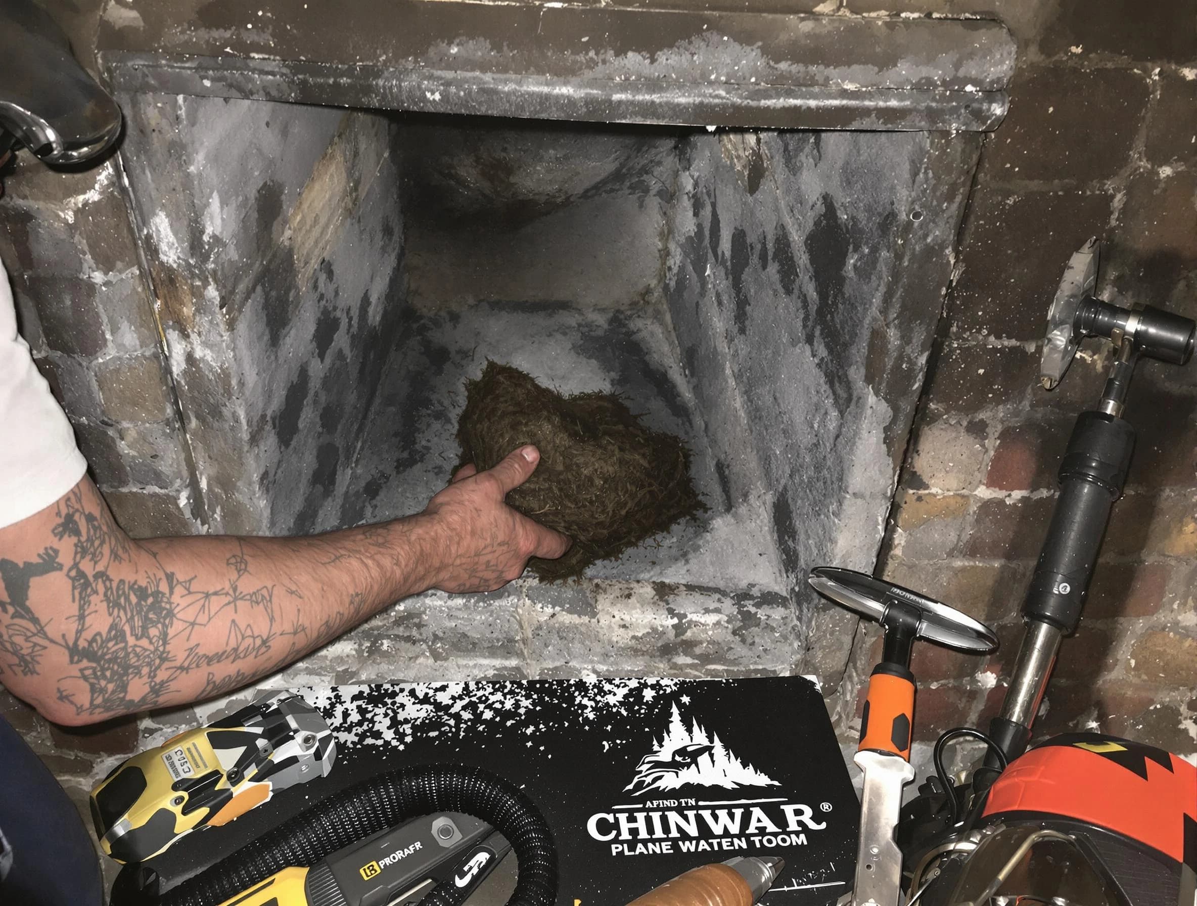 North Brunswick Chimney Sweep safely removing debris and screening chimney in North Brunswick, NJ
